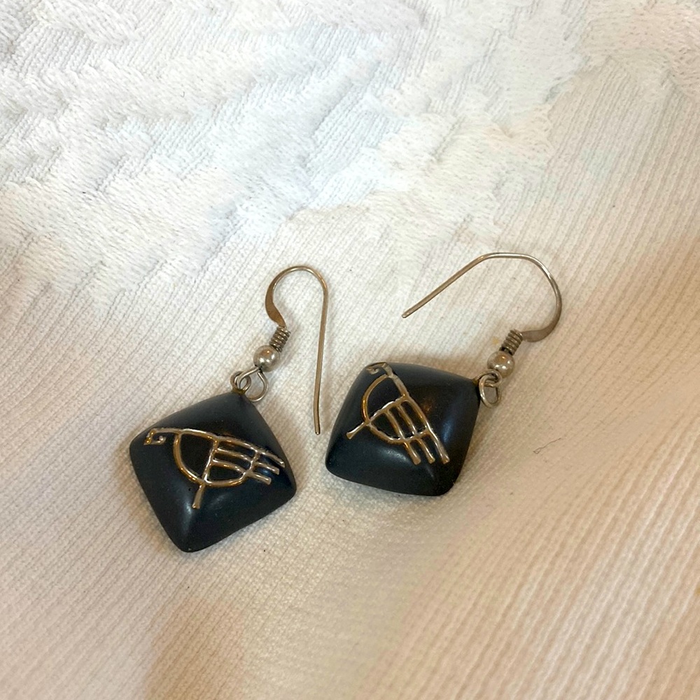 5/$25. Dark gray 60s hippie look hieroglyphic motif earrings. Pierced hooks
